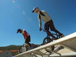 HD Super Slow-Mo: BMX Riders Start Racing From The Gate Stock Footage