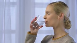 Woman drinking water Stock Footage