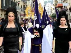 Young Ladies in the parade in Holy week at the Semana Santa, Malaga, Andalucia, Spain, Europe Stock Footage