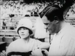 B/W 1927 Babe Ruth + sister Mamie standing next to each other in ballpark / newsreel Stock Footage