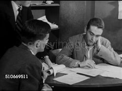 1951: HARVARD UNIVERSITY LIFESTYLE: WS Males outside building, sign above door 'The Harvard Crimson', VS Males at desks working on daily newspaper, male marking ad 'For Sale Buick ...' as paid. Editorial Office, males meeting at desk. Printing pages. Instructional Video