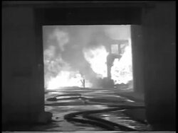 B/W 1934 thru doorway of building on fire in Chicago stockyard / newsreel Stock Footage