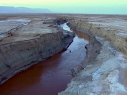  AERIAL WS TS View of muddy surface of dead sea in desert / Sourn Judea Desert, Israel  Stock Footage