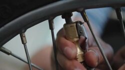 inflating motorcycle tire Stock Footage