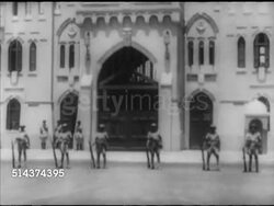1952: EGYPT REVOLUTION: ALEXANDRIA: TU/TD Montazah Palace w/ Egyptian soldiers in line across front of courtyard.  Note: Focus not crisp.  CAIRO, EGYPT: MS Painting of King Farouk being removed from Ministry wall. Instructional Video