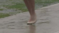 Feet walking in the rain News Clip