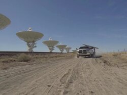 WS POV Truck moving past satellite dishes at Very Large Array / San Augustine, New Mexico, USA   Stock Footage