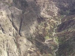 WS AERIAL View of Brown rock canyon and valley in state park / Wyoming, United States Stock Footage