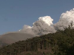 Steam and ash pour from Kirishima volcano Shinmoe crater / AUDIO Stock Footage