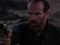 'Cowboy turns around with gun, grabs chest as he gets shot.' Stock Footage