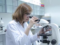 HD : Scientist Couple using microscope Stock Footage
