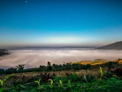 Fogs rolling over the hills in early morning Stock Footage