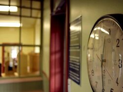 A clock on a wall with a red second-hand Stock Footage