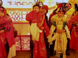 MS TS Actors carry children dressed as ancient figures during shehuo performances at city wall new year lantern festival, Shehuo is traditional festive folk celebration during chinese spring festival AUDIO / xi'an, shaanxi, china Stock Footage