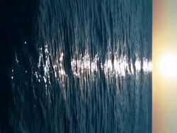 Sunrise at sea, loopable, vertical Stock Footage