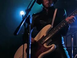 Musician singing and playing the bass on stage. Stock Footage