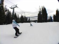 snowboarders riding follow shot Stock Footage