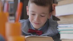 Boy doing homework Stock Footage
