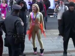 GMAâ€™s Sara Haines & Sasha Cohen (2006 Olympic silver medalist) in their figure skating costumes walking back into the Good Morning America show Stock Footage