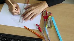 Female architect drawing house in office Stock Footage