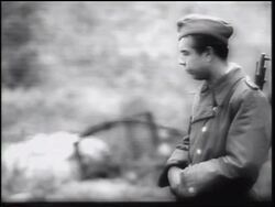 B/W 1961 bored soldier carrying gun guarding Berlin Wall / leaning on railing / Germany / newsreel Stock Footage