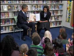 President Barack Obama and First Lady Michelle Obama read the 'Moon Over Star' to second graders at the Capital City Public Charter School in Washington, D.C. News Clip