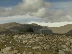 Pull Back Shot From Tent on Rocky Terrain Lhasa Tibet China  Stock Footage