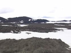 MS AERIAL View of snowy mountain at Cinder cone on lava plain / Iceland Stock Footage