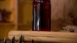 A stuffed bear holds a tray of beer and wears a bow tie in a ski lodge. Stock Footage