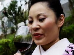 Japanese Woman Enjoying Red Wine Stock Footage