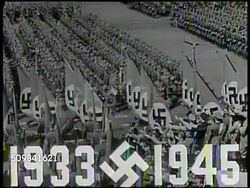 1939: GERMAN NAZI RALLY: '1933-1945' superimposed over VS Nazi Germany Nuremberg stadium rally, soldiers marching w/ Swastika flags, crowds Nazi saluting, Atles Museum, crowds saluting. Hitler Salute, WWII Instructional Video