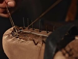 HD Super Slow-Mo: Shoemaker Welting A Shoe Stock Footage