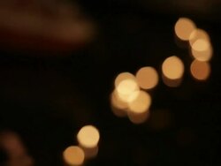 MS R/F Illuminated offerings floating down river Ganges at night / Varanasi, India Stock Footage
