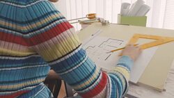Architect drawing blueprint in office Stock Footage