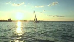 The large sailing yacht Heroina sails through Narragansett Bay at sunset. Stock Footage