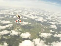 Woman sky diver performs acrobatic mid-air stunts Stock Footage