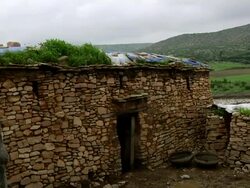 Ethiopian men build a stone enclosure Stock Footage