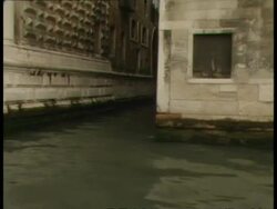 POV from boat, of building details and waterline including narrow canal separating buildings, Venice Stock Footage