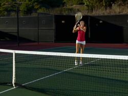 WS, PAN, Two young women shaking hands above tennis net, Santa Barbara, California, USA Stock Footage