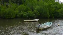 Pohnpei Micronesia boats on water at local homes used for fishing Stock Footage