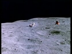 WA Moon Rover on lunar surface, lunar module in background Stock Footage