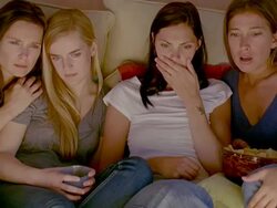 CU, Four women watching television in living room, Saint Ferme, Gironde, France Stock Footage