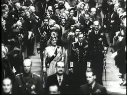 Princess Elizabeth and Prince Philip walk hand in hand followed by their wedding party during the ceremony in Westminster Abbey. News Clip