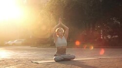 Young Woman Doing Yoga Meditation Exercises at Sunset Stock Footage