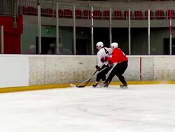 HD:Slo-Mo Shot of Three Ice Hockey Players by the Fence Stock Footage