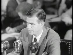 B/W 1949 high angle Alger Hiss testifying to HUAC denying that he is a Communist / newsreel Stock Footage