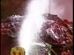 MCU Fire fighter hosing down chemicals with foam Stock Footage