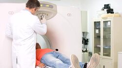 Doctor doing a CAT scan on a patient Stock Footage