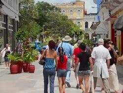 MS Shot of sancti spiritus cuba downtown walking street, shopping along stores in Caribbean / Sancti Spiritus, Cuba Stock Footage