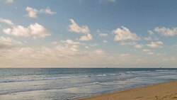 Beach scene showing sand, sea and sky Stock Footage